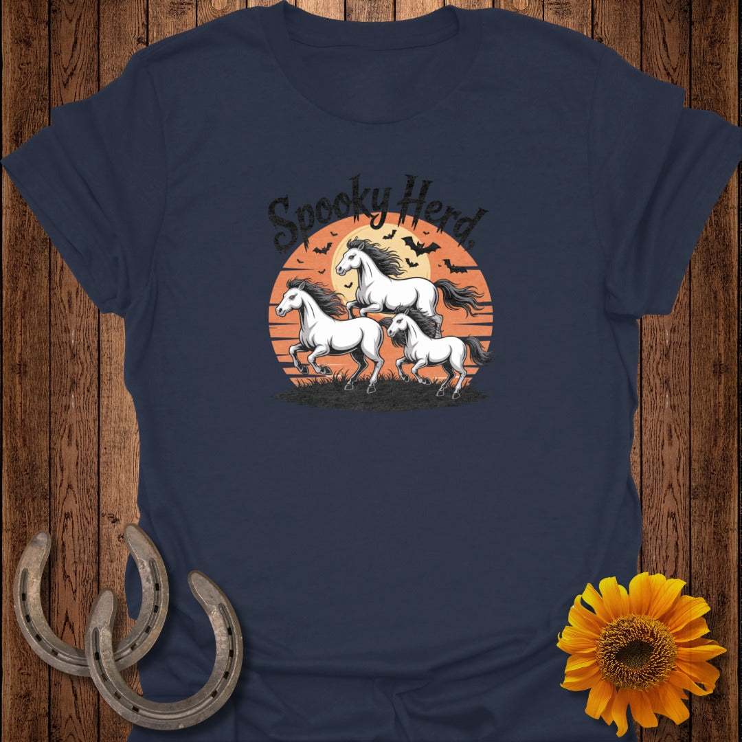 T-shirt with three white horses running against a sunset, with bats and the text "Spooky Herd."