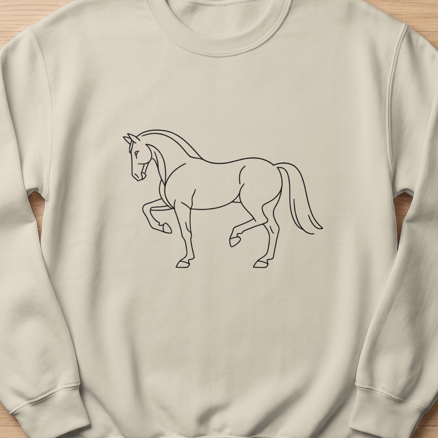 Line art of a horse in profile on a cream sweatshirt.