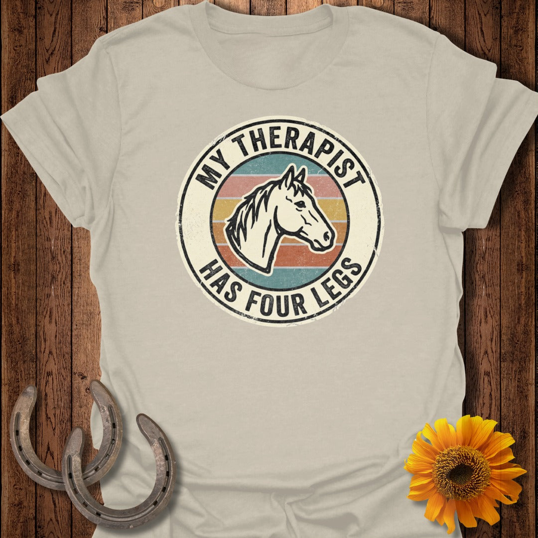 T-shirt with "My Therapist Has Four Legs" text and horse head graphic.