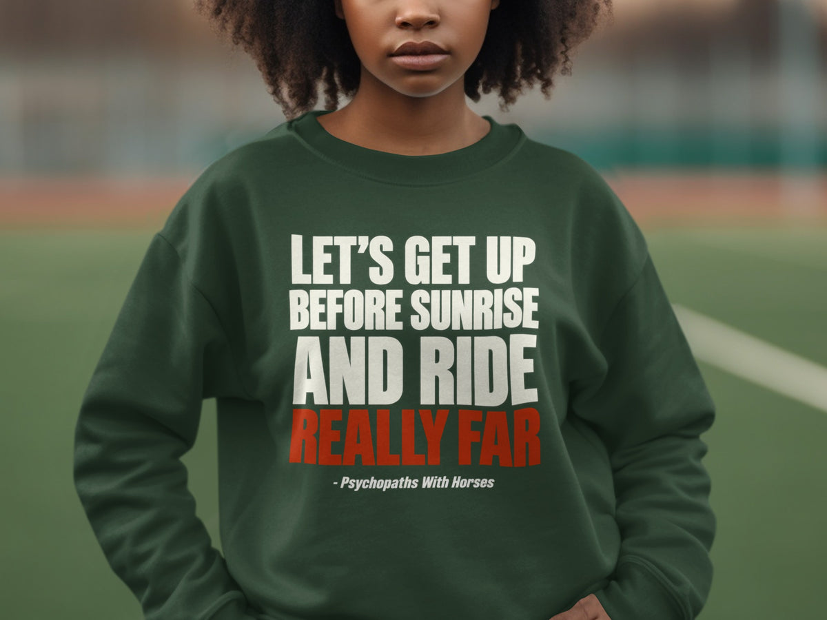 A person wears a dark green crewneck sweatshirt featuring white and red text.