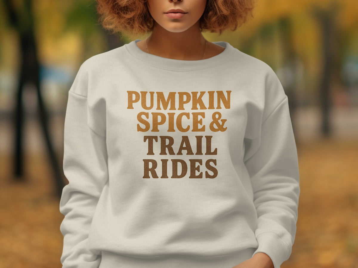 Lightweight cream sweatshirt with "PUMPKIN SPICE & TRAIL RIDES" text.