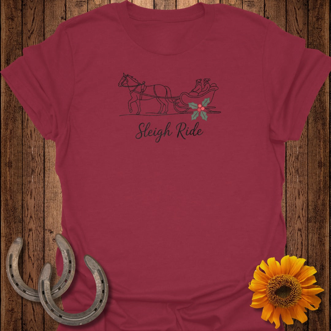 Maroon t-shirt with line drawing of horse-drawn sleigh and text "Sleigh Ride."