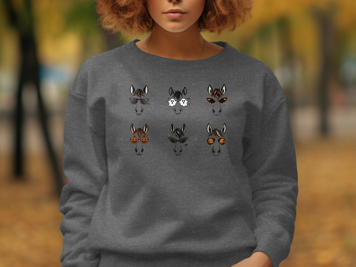 Six horse heads in Halloween-themed glasses on a grey sweatshirt.
