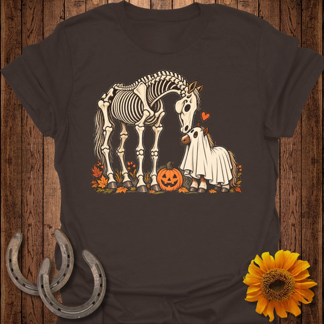 Skeleton horse and small horse in ghost costume with pumpkin and leaves.