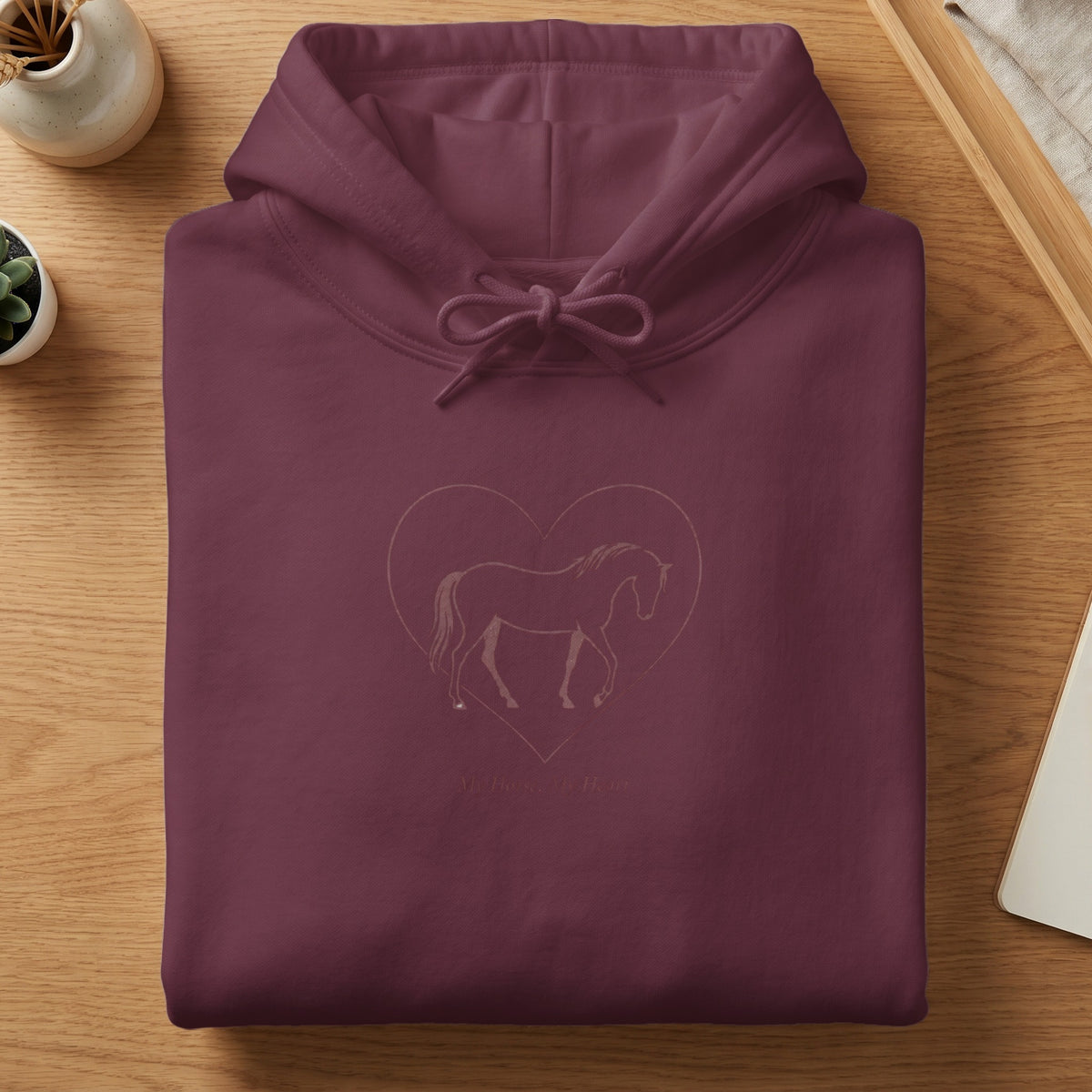 Maroon hoodie with a horse outline inside a heart and text.