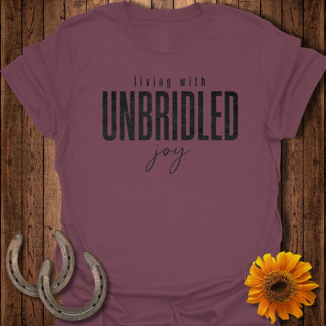 Burgundy t-shirt with "Living with Unbridled Joy" text and horseshoes.