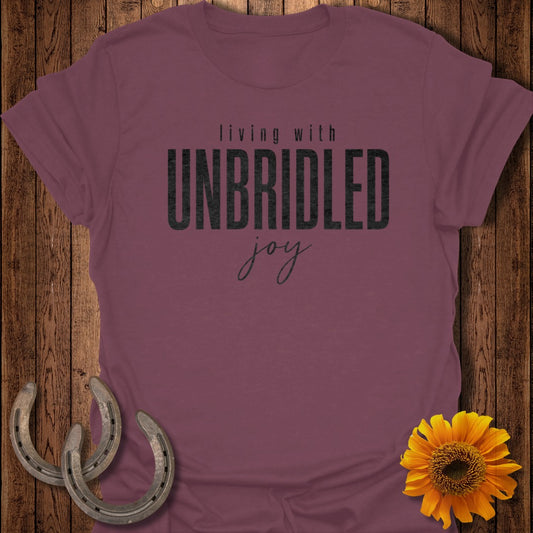 Burgundy t-shirt with "Living with Unbridled Joy" text and horseshoes.
