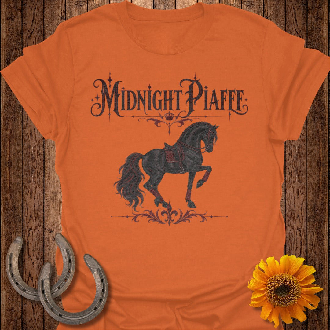 Orange t-shirt with "Midnight Piaffe" text and a black horse graphic.