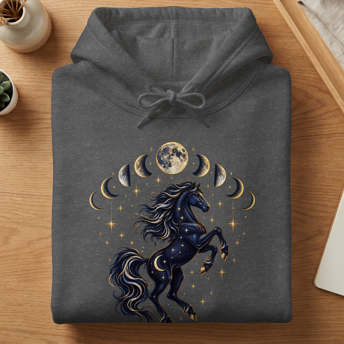 Dark grey hoodie with a celestial horse and moon phase graphic design.