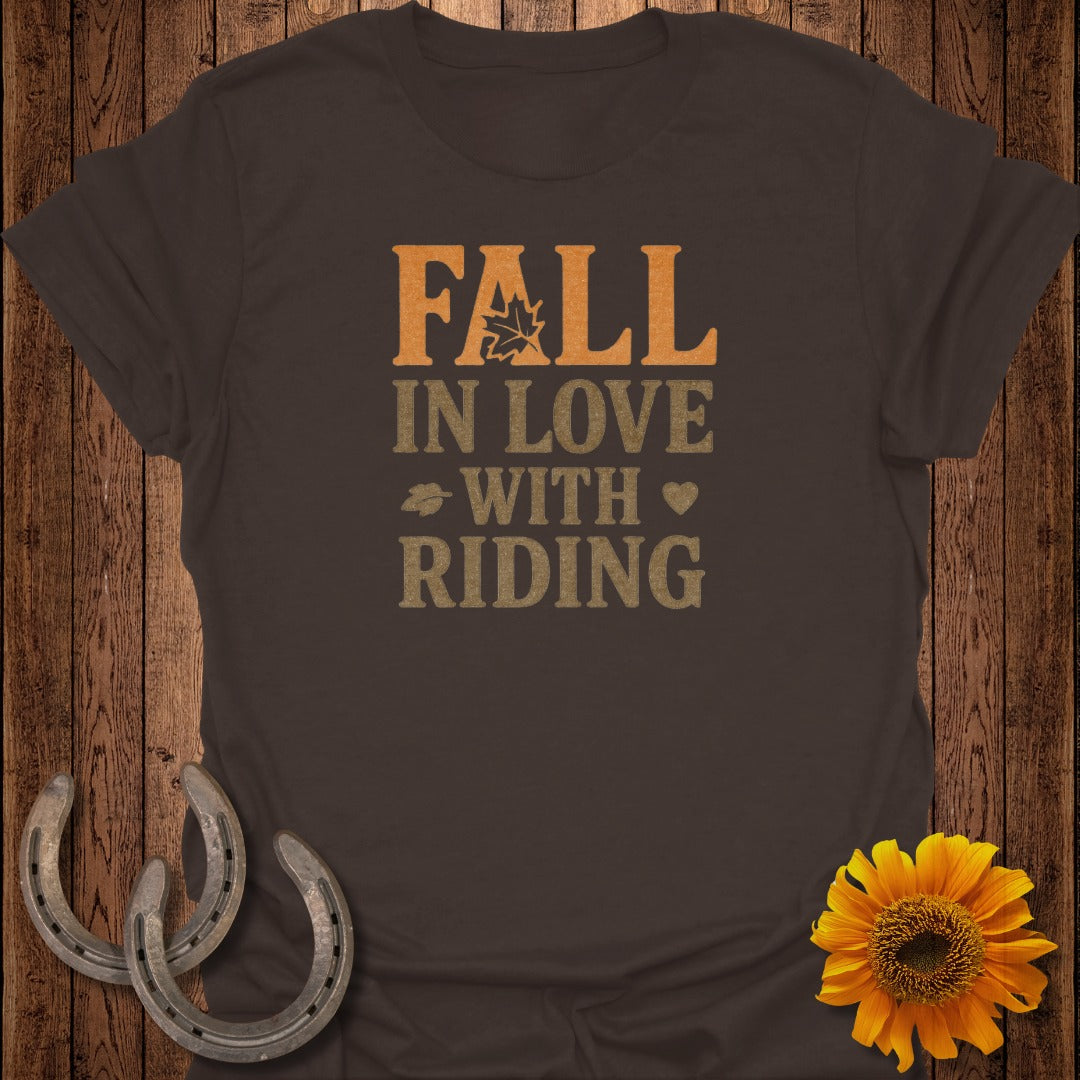 Brown t-shirt with "Fall in Love with Riding" text, maple leaf, horseshoes, and sunflower.