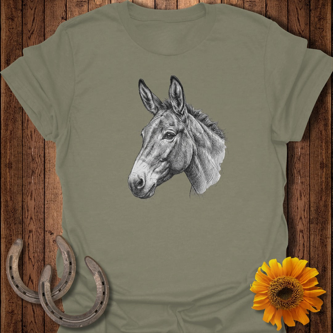 Mule head sketch on a tan t-shirt with sunflowers and horseshoes.
