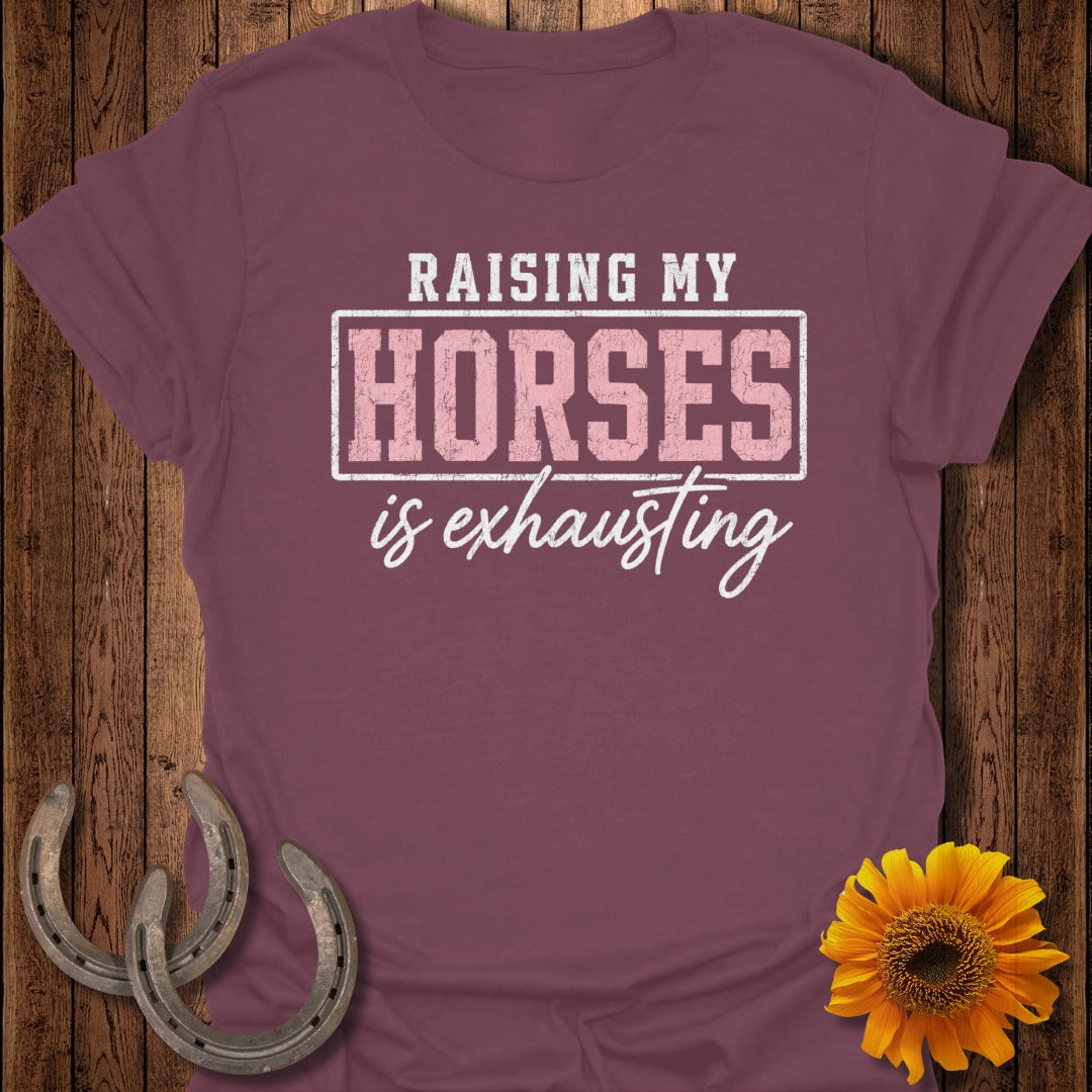 Maroon t-shirt with "Raising My Horses is Exhausting" text and two horseshoes.