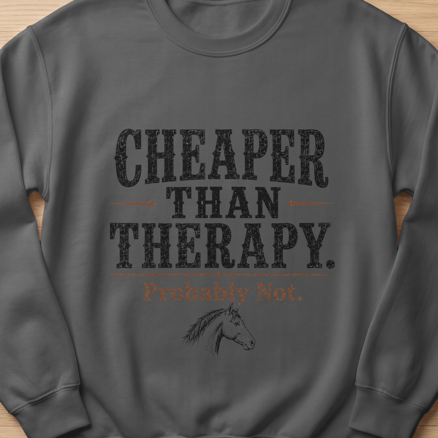 Dark gray sweatshirt with text: CHEAPER THAN THERAPY. Probably Not. Horse head graphic.