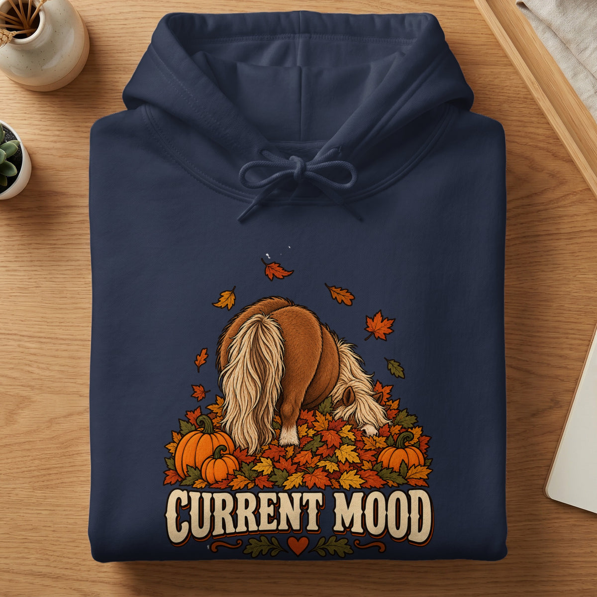Navy hoodie with a graphic of a pony surrounded by pumpkins and autumn leaves, text reads "CURRENT MOOD".