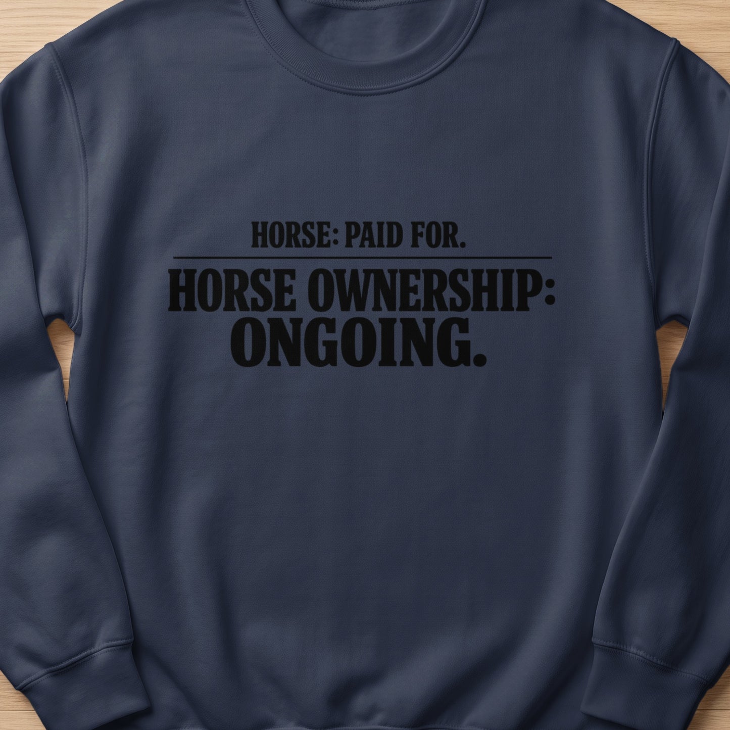 Navy sweatshirt with black text "HORSE: PAID FOR. HORSE OWNERSHIP: ONGOING."