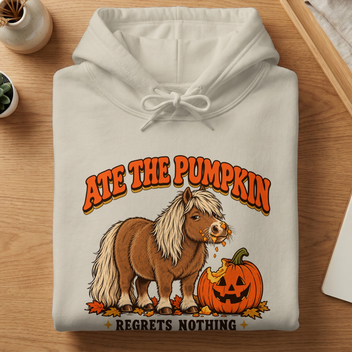 Pony eating a pumpkin with text "Ate the Pumpkin" and "Regrets Nothing".