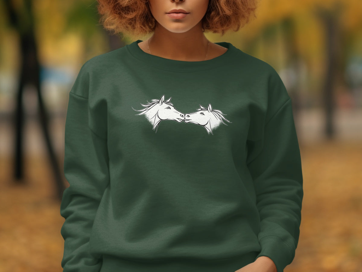 Dark green sweatshirt with a white outline drawing of two horses touching noses.