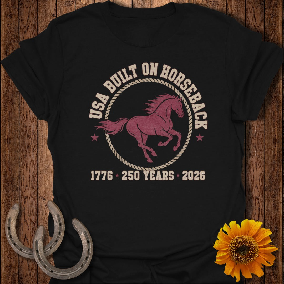 Black t-shirt with "USA Built On Horseback 1776 250 Years 2026" and horse graphic.