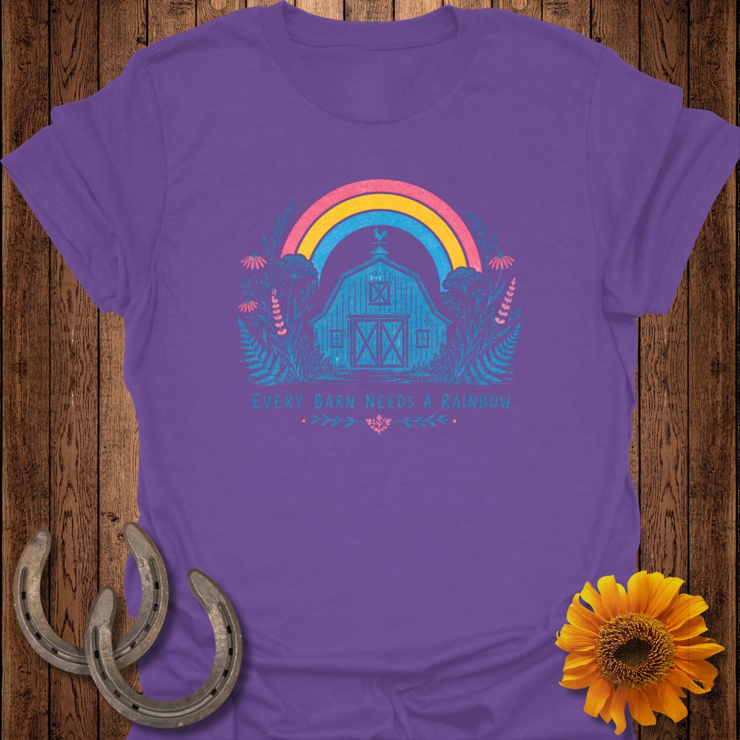 Purple t-shirt with barn and rainbow design, and text "Every Barn Needs a Rainbow".