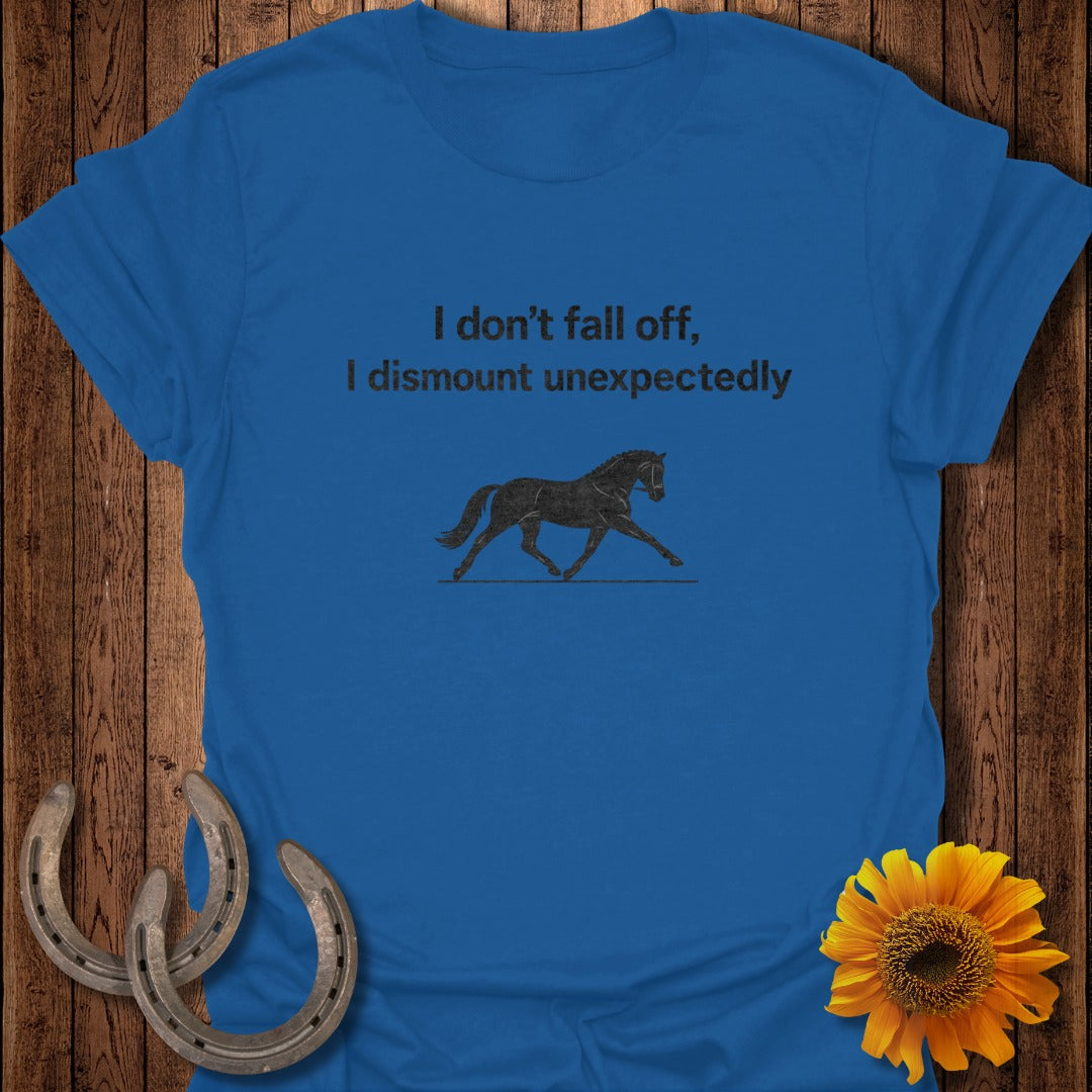 Royal blue t-shirt with text "I don't fall off, I dismount unexpectedly" and horse graphic.