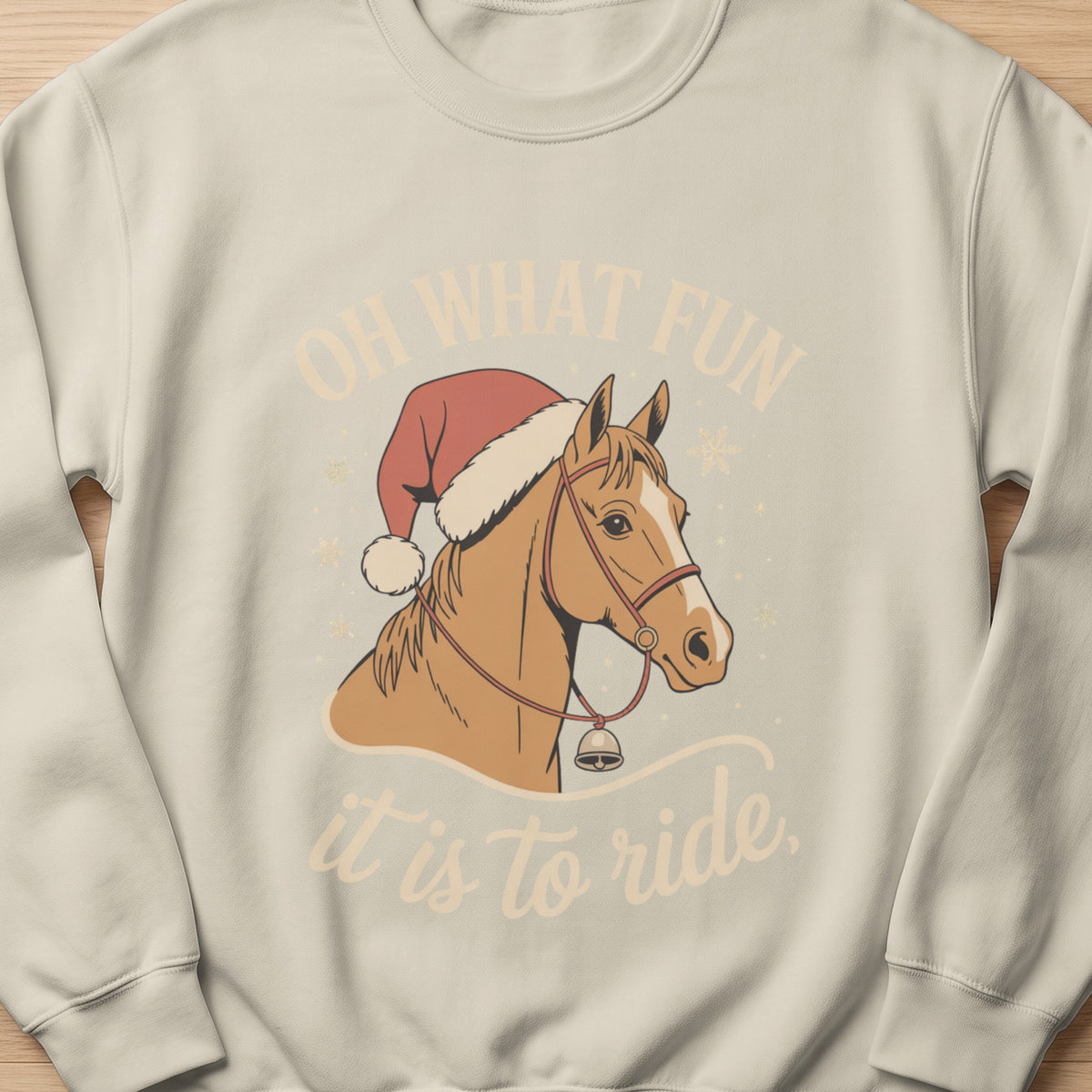 Light cream sweatshirt with horse wearing Santa hat and text "OH WHAT FUN it is to ride."