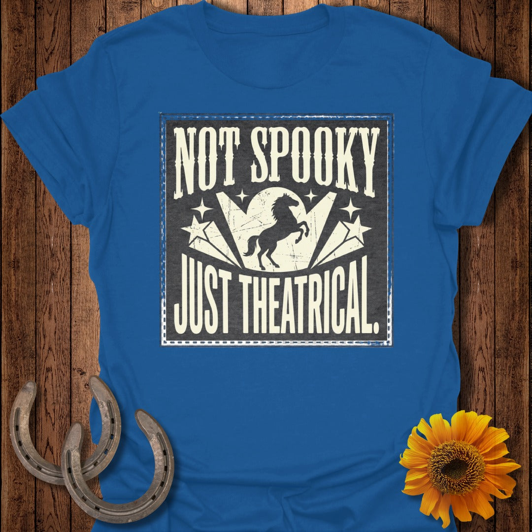 Blue t-shirt with "NOT SPOOKY JUST THEATRICAL" in distressed white text.