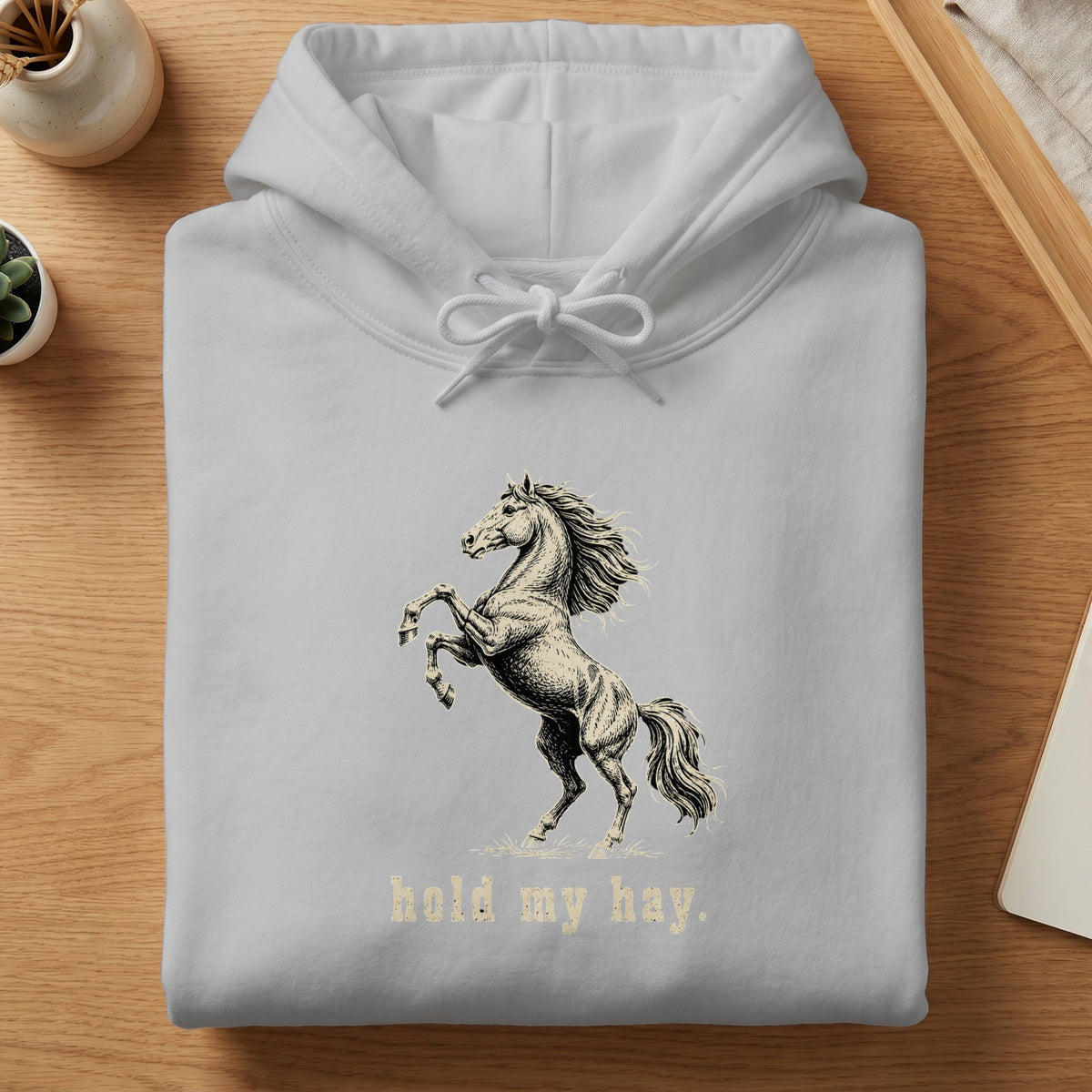 Light grey hoodie with a rearing horse graphic and "hold my hay" text.