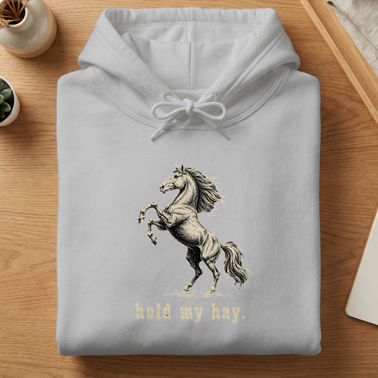 Light grey hoodie with a rearing horse graphic and "hold my hay" text.