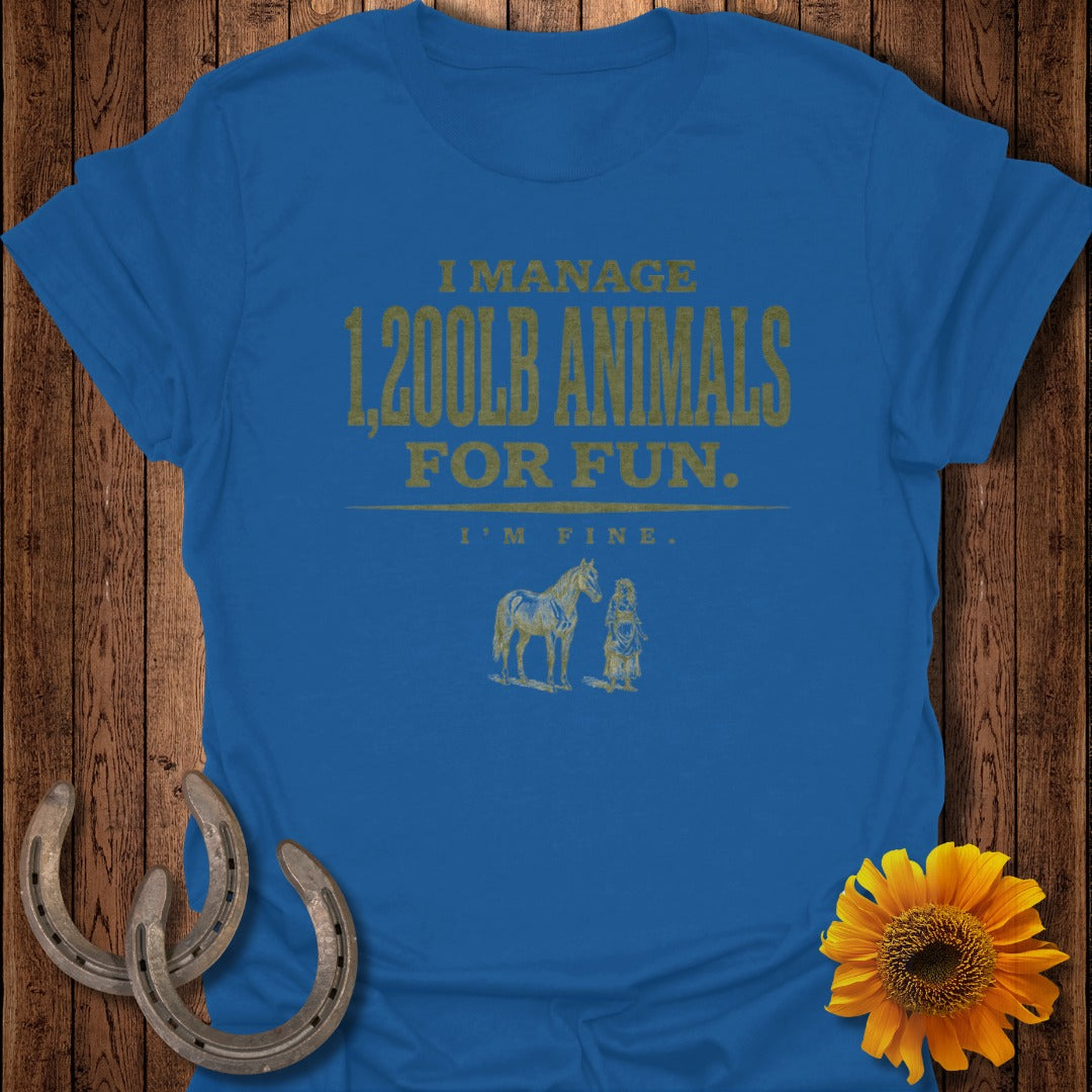 Blue t-shirt with gold text "I MANAGE 1,200LB ANIMALS FOR FUN. I'M FINE." and horse illustration.