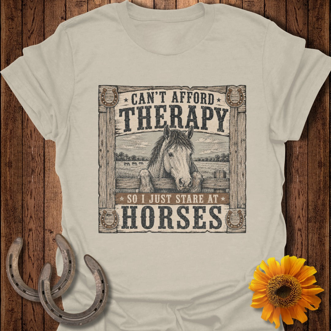 "Can't afford therapy so I just stare at horses" text on a t-shirt with horse graphic.