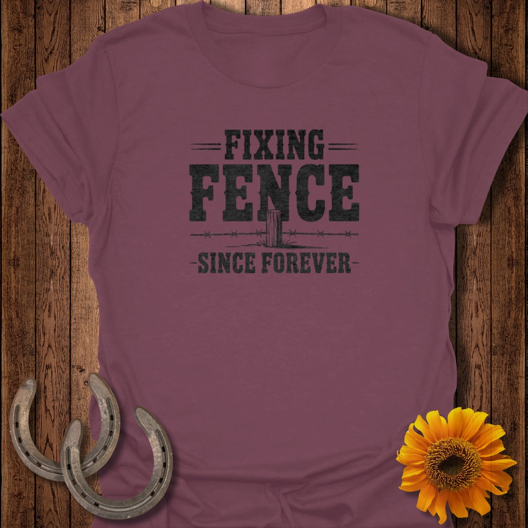 Maroon t-shirt with "Fixing Fence Since Forever" text and barbed wire graphic.