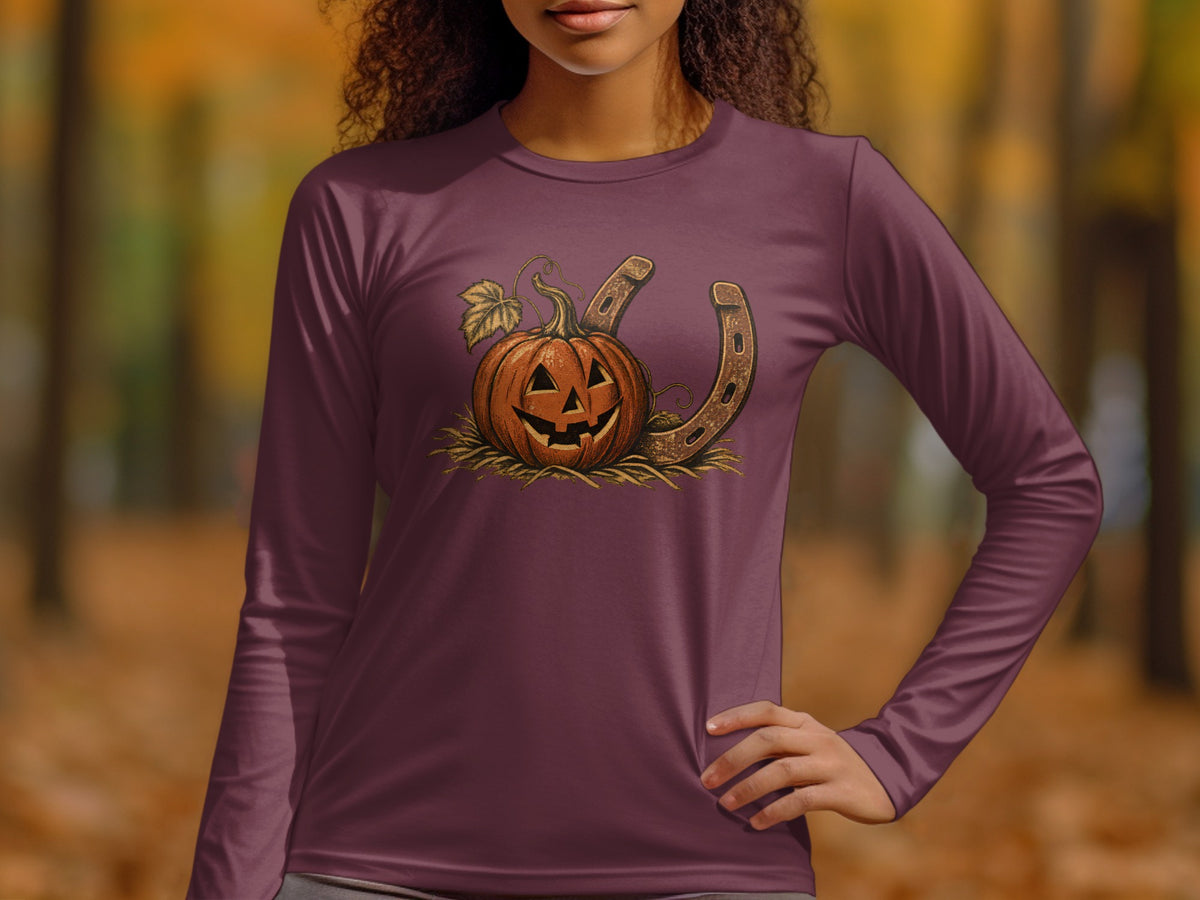 Jack-o'-lantern and horseshoe graphic on a maroon long-sleeved shirt.