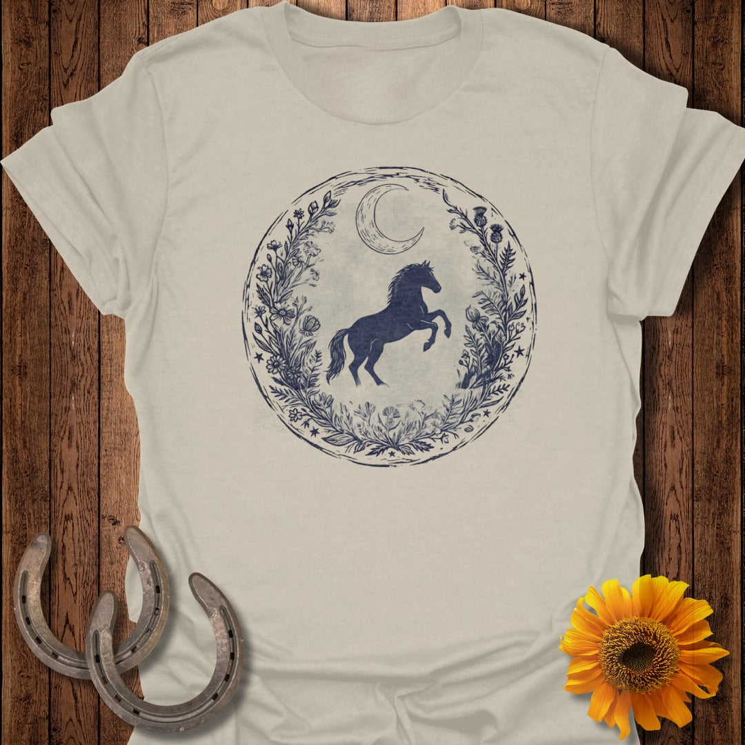 T-shirt with a horse, moon, and floral wreath design.