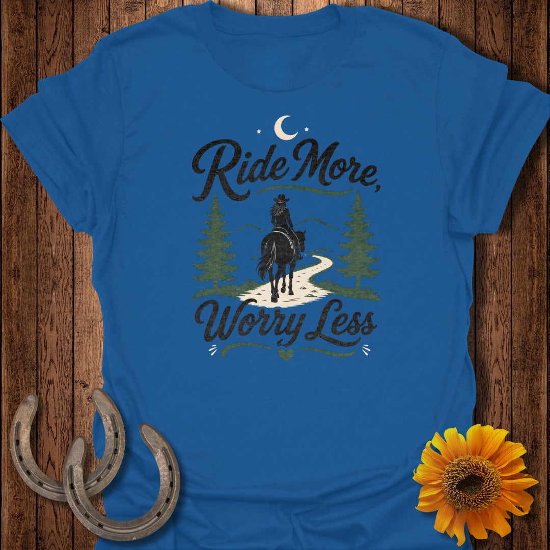Blue t-shirt with "Ride More, Worry Less" text and a cowboy on a horse.