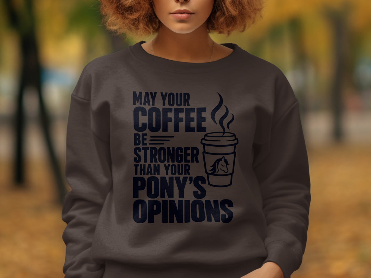 Dark sweatshirt with navy text: May your coffee be stronger than your pony's opinions.