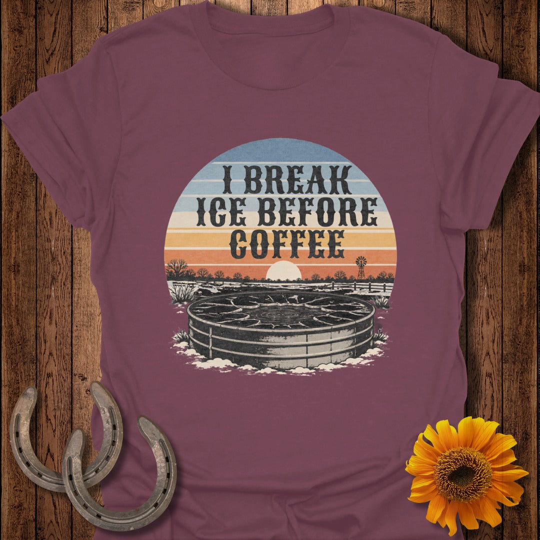 Maroon t-shirt with graphic "I BREAK ICE BEFORE COFFEE" over a water trough.