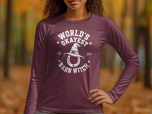 Maroon long-sleeve shirt with "World's Okayest Barn Witch" graphic.
