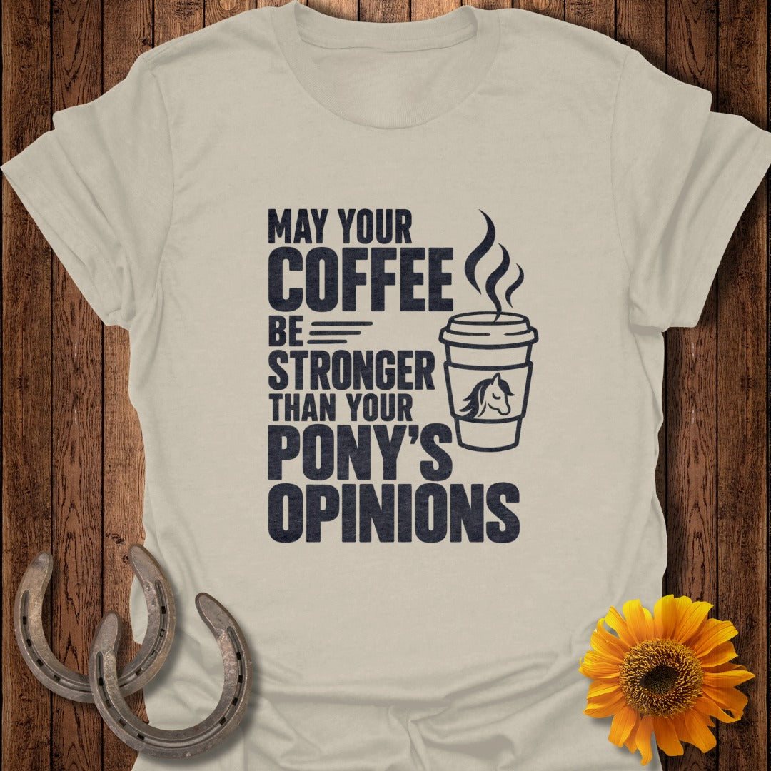A light gray t-shirt with black text that reads, "May your coffee be stronger than your pony's opinions."