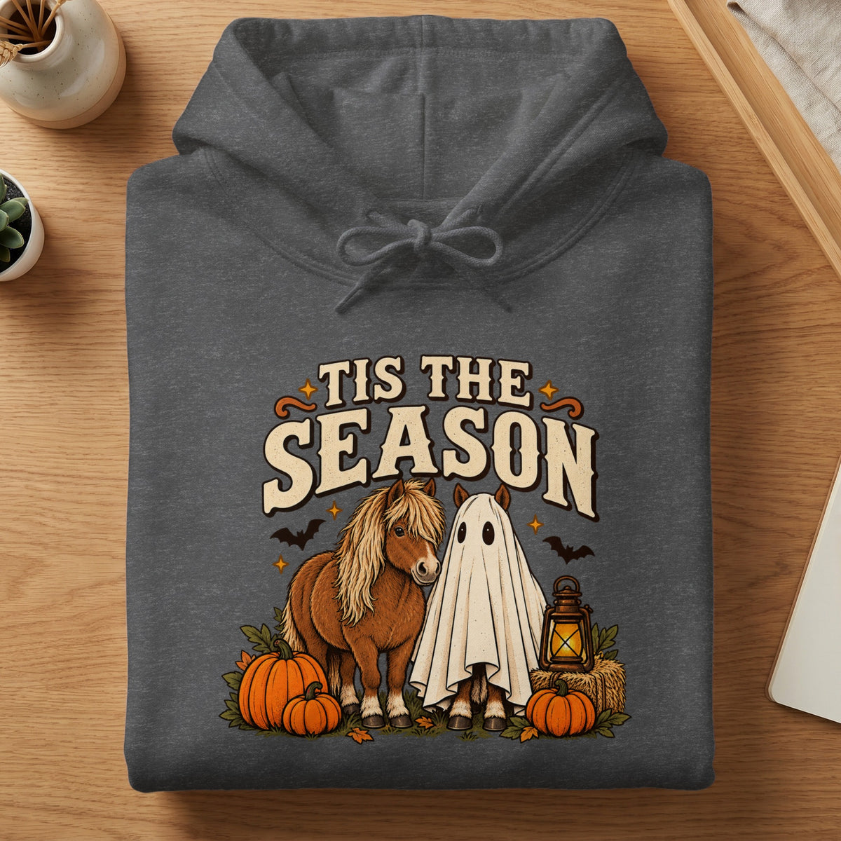 Dark grey hoodie with horses, one in a ghost costume, and pumpkins.