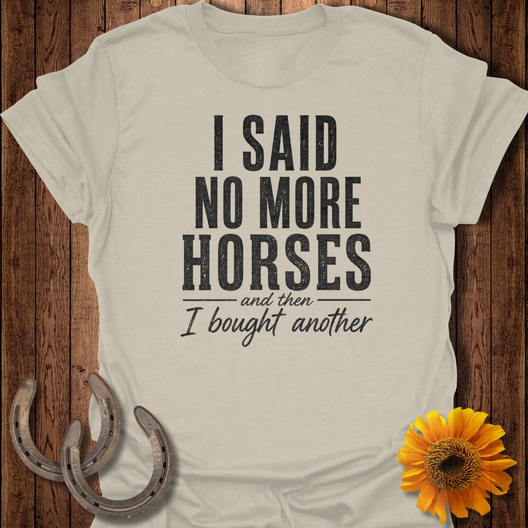"I said no more horses" and "I bought another" text on a cream t-shirt.