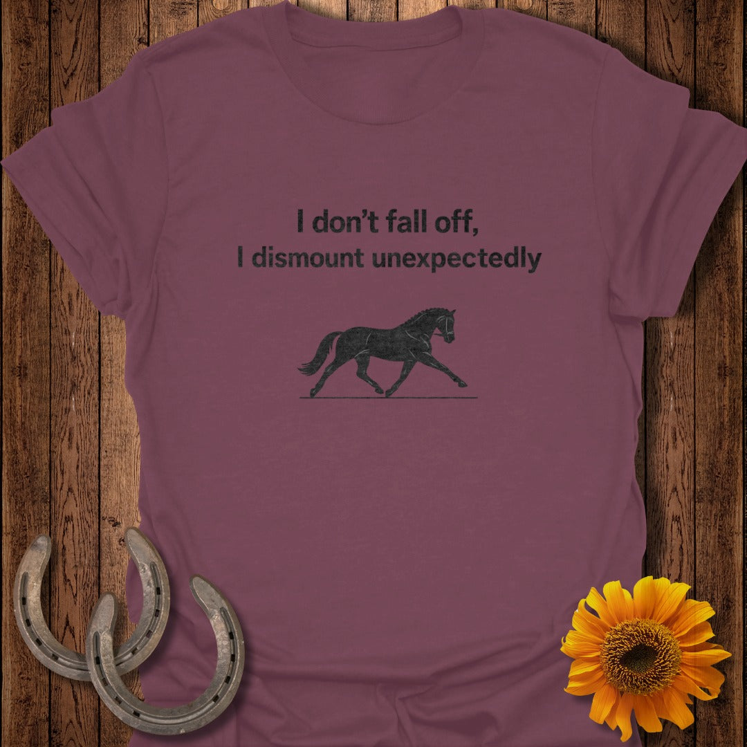 Maroon t-shirt with horse graphic and text "I don't fall off, I dismount unexpectedly."