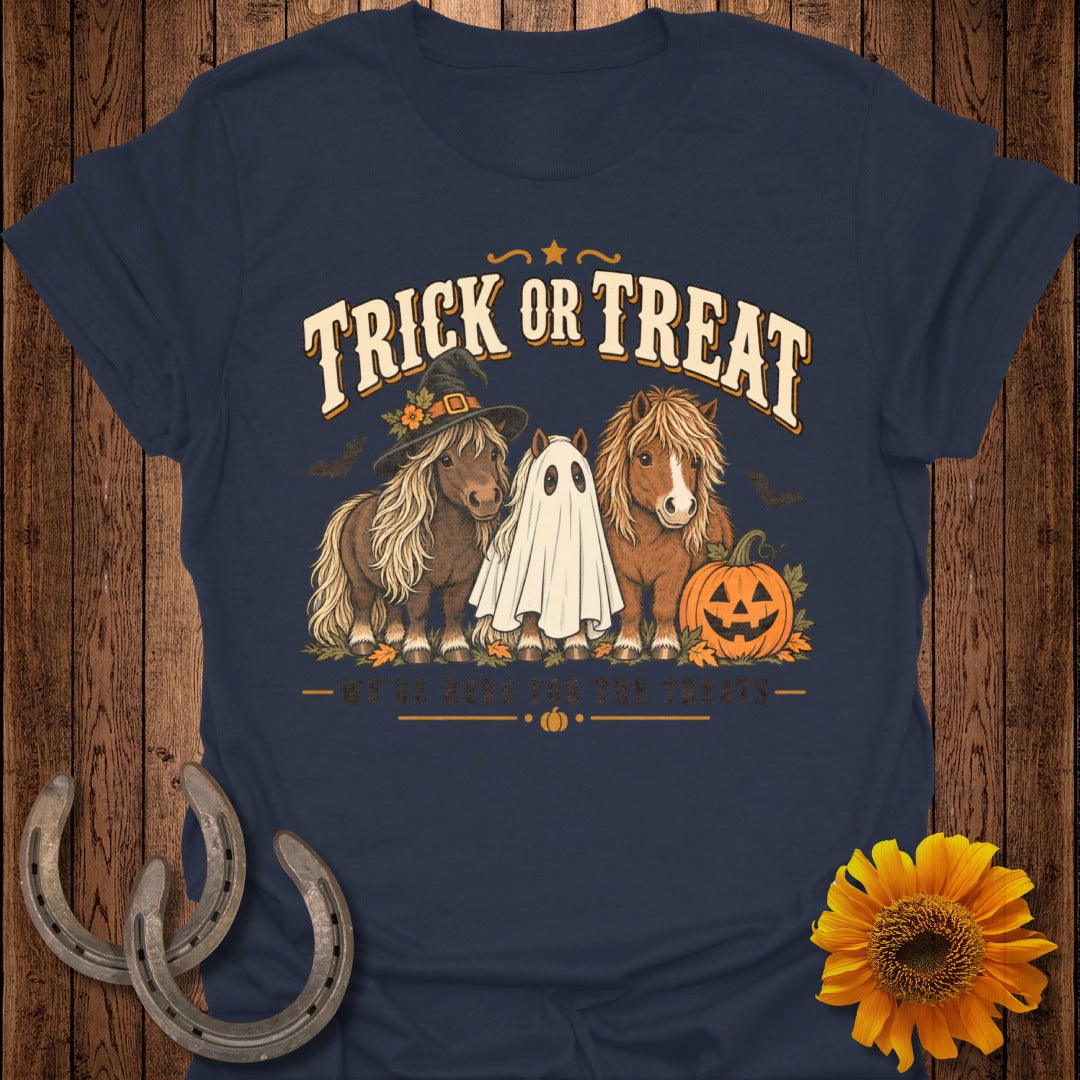 Two ponies, one in a witch hat, and one as a ghost, with text "Trick or Treat."