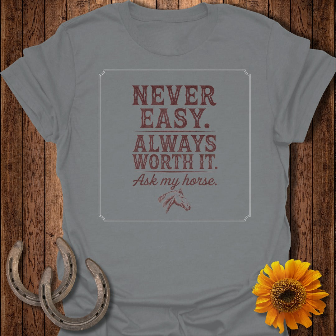 Grey t-shirt with "Never Easy. Always Worth It. Ask my horse." text and horse graphic.