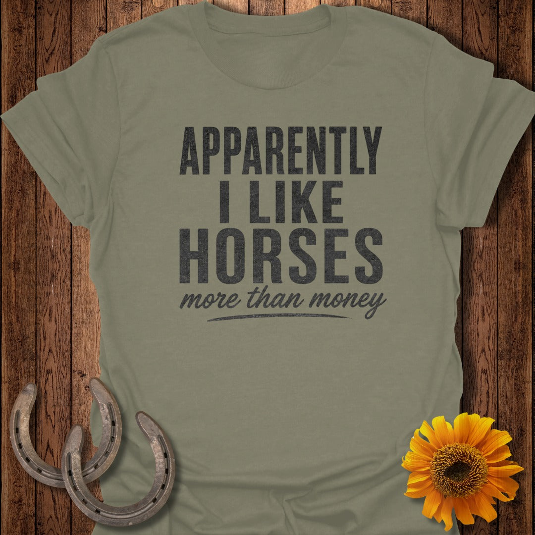 Olive green t-shirt with "Apparently I Like Horses more than money" text.