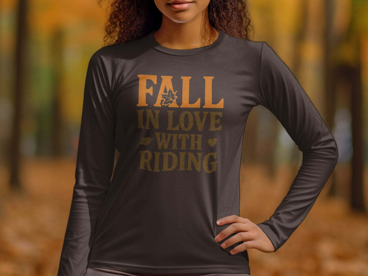 Dark long-sleeve shirt with text "FALL IN LOVE WITH RIDING" and fall imagery.