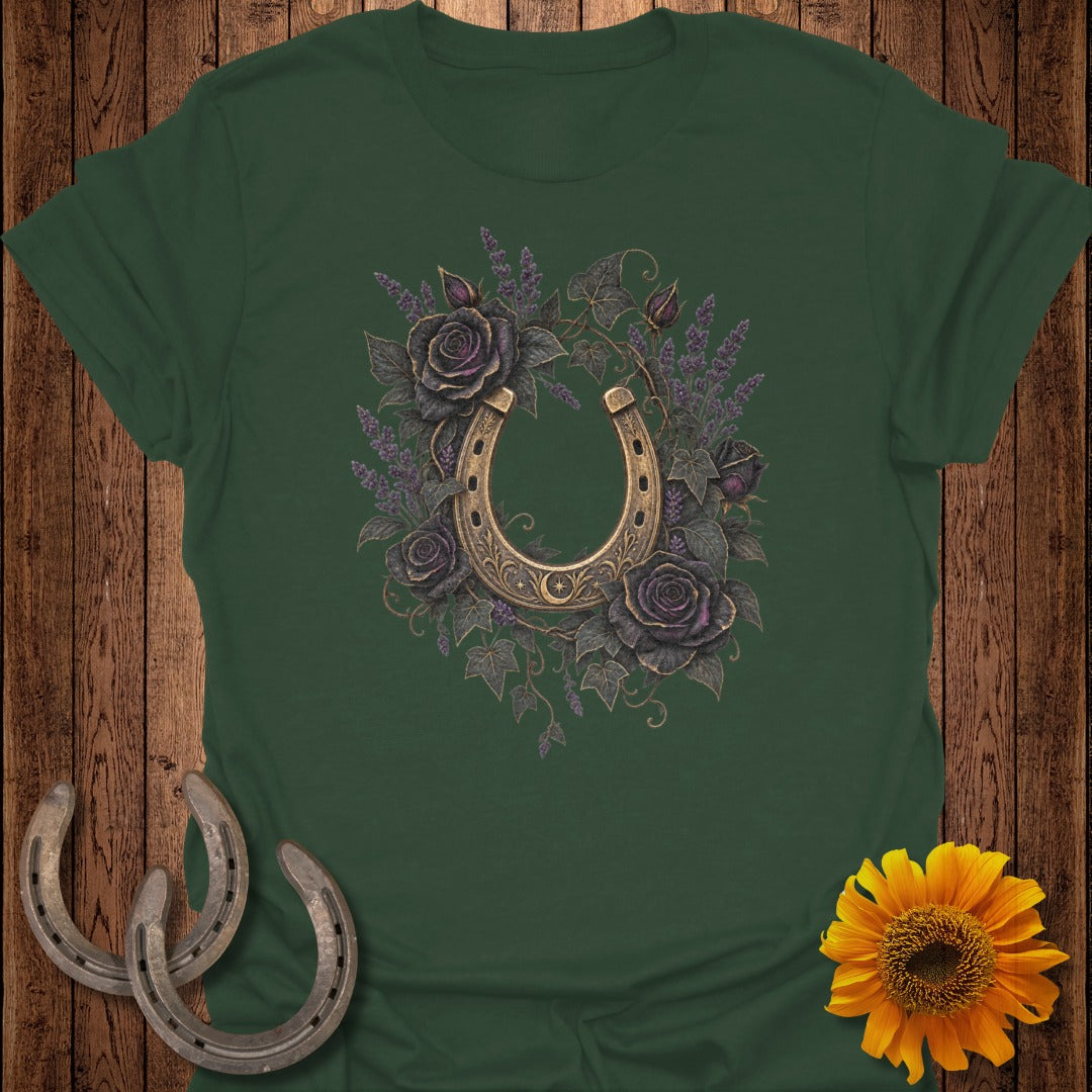 Green t-shirt with a golden horseshoe surrounded by dark roses and lavender.