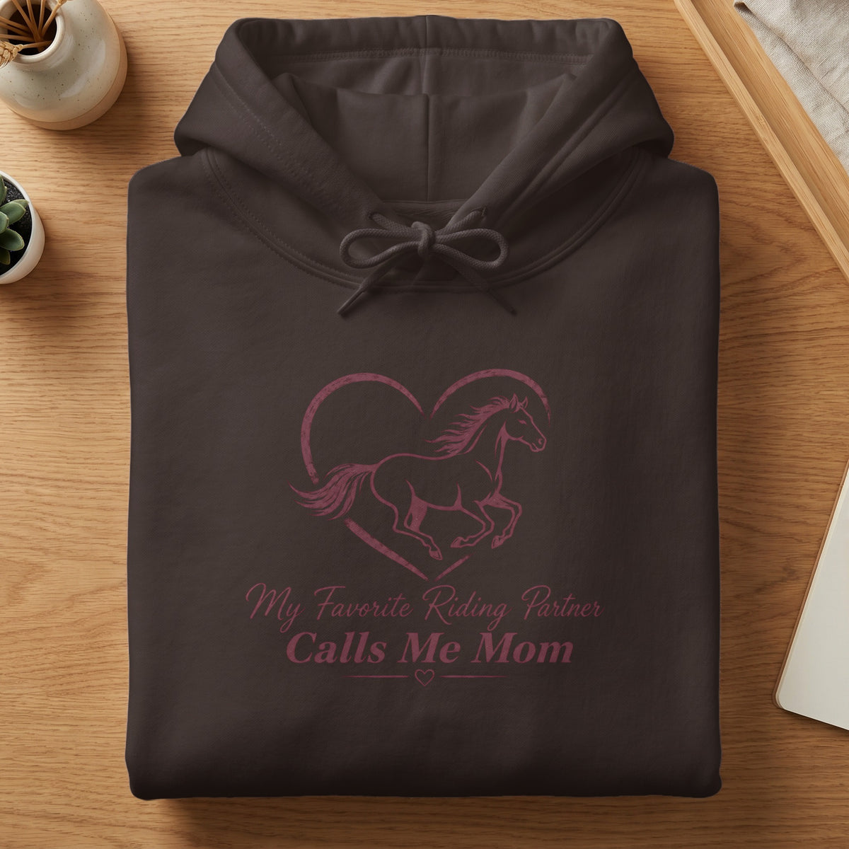 Brown hoodie with horse and heart graphic and text "My Favorite Riding Partner Calls Me Mom".