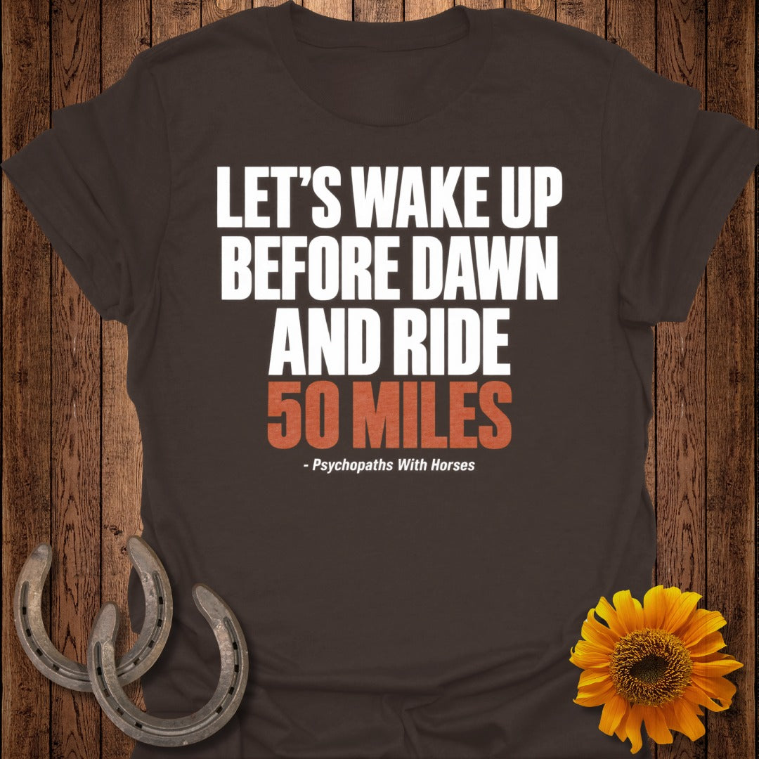 Brown t-shirt with white text "LET'S WAKE UP BEFORE DAWN AND RIDE 50 MILES"