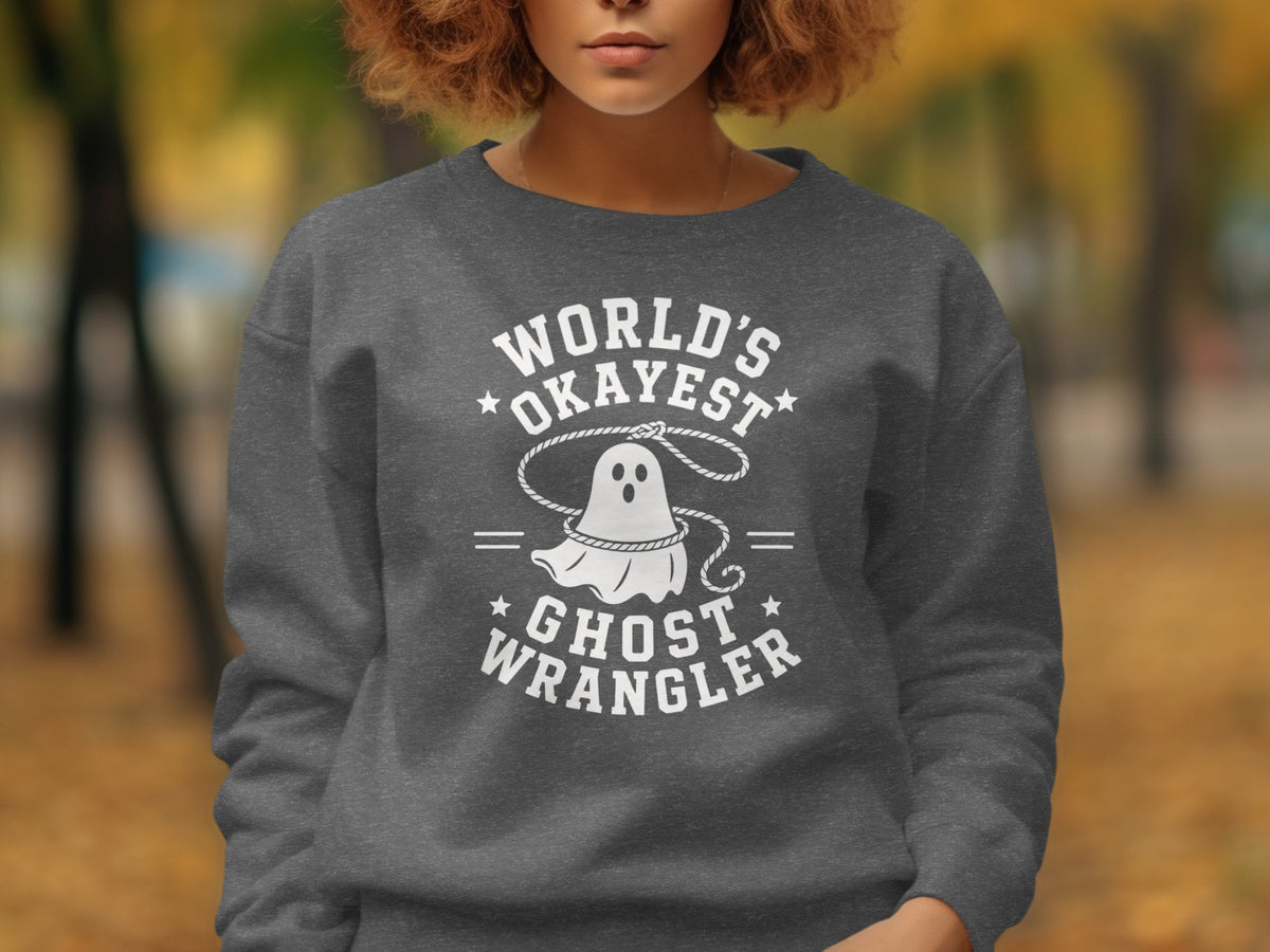 Dark grey sweatshirt with "World's Okayest Ghost Wrangler" text and ghost graphic.