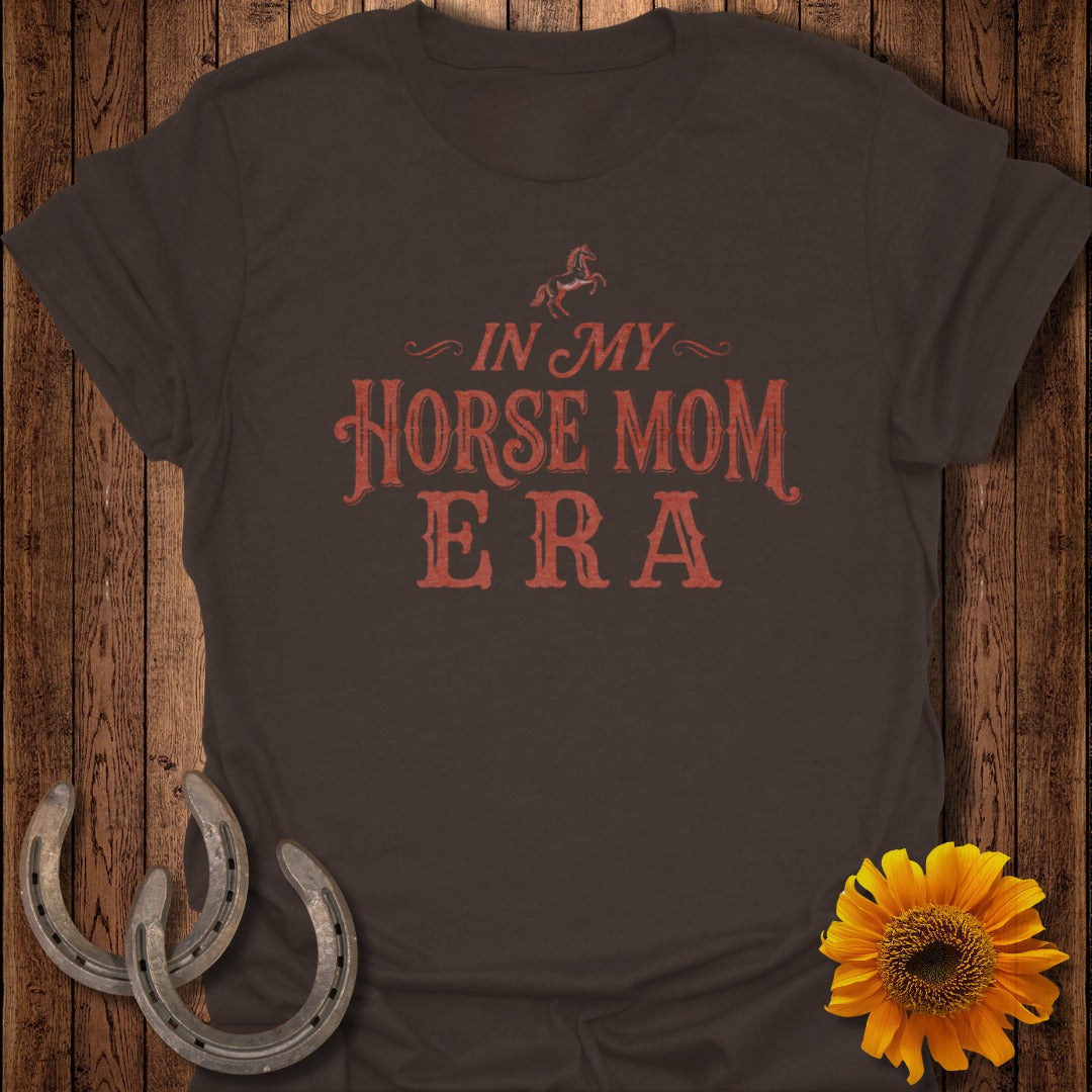 Brown t-shirt with "IN MY HORSE MOM ERA" text, horseshoes, and sunflower.